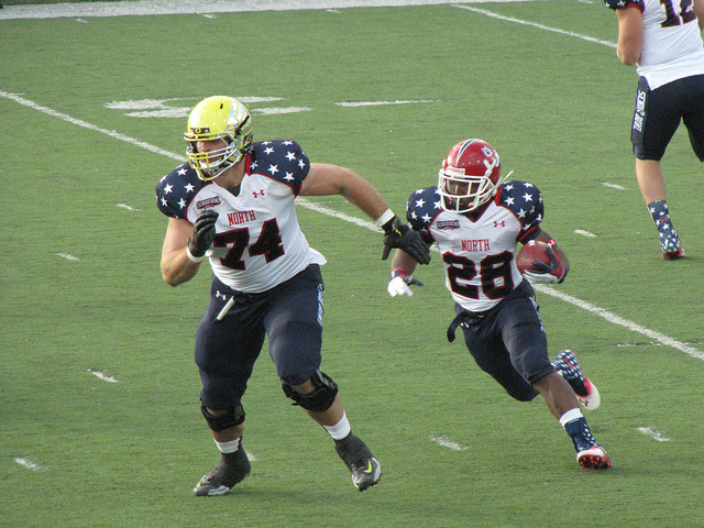 OL Kyle Long leads block during Senior Bowl game.